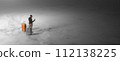 Man Standing Alone with Luggage on a Foggy Surface, Using Smartphone 112138225