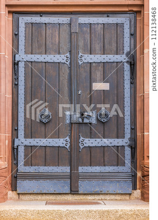 wooden door in a brick wall wooden door in a brick wall 112138468