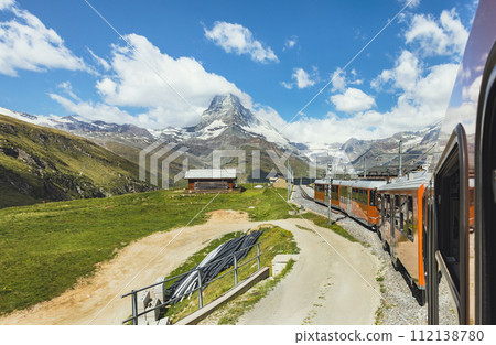 train on the background of the Matterhorn mountain in the Swiss Alps train on the background of the Matterhorn mountain in the Swiss Alps 112138780