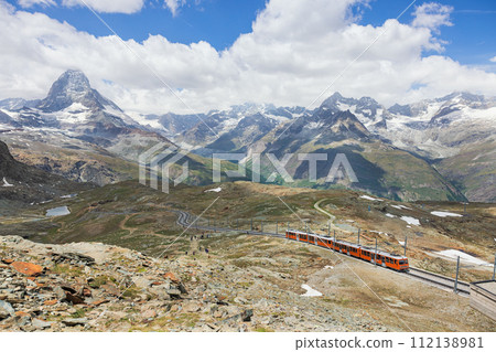 train on the background of the Matterhorn mountain in the Swiss Alps 112138981