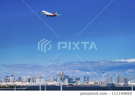 Scenery of Haneda Airport, plane taking off and Tokyo Skytree, Ota Ward, Tokyo 112140669