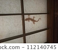 Silhouette of a gecko behind the shoji screen in a Japanese-style room 112140745