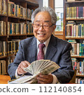 An elderly Japanese man is happily counting money. 112140854