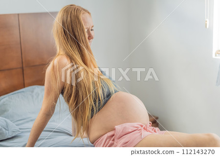 Expectant woman enters the labor phase, navigating the intense journey of childbirth with strength, resilience, and the anticipation of welcoming new life Expectant woman enters the labor phase, navigating the intense journey of childbirth with strength, resilience, and the anticipation of welcoming new life 112143270