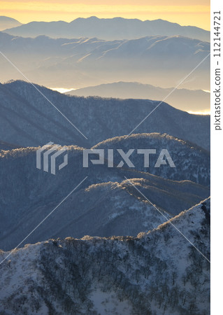 Early spring mountain range and sunrise 112144721