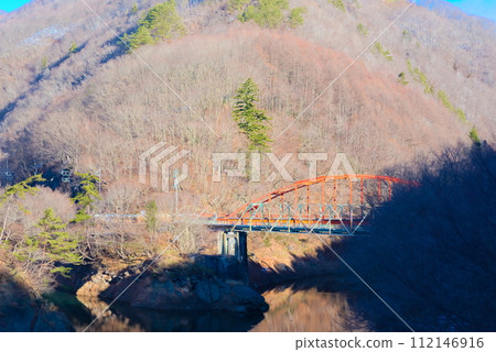 Tone River, red overpass and mountains in autumn 112146916