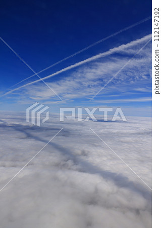 Straight clouds stretching above the sea of clouds Straight clouds stretching above the sea of clouds 112147192