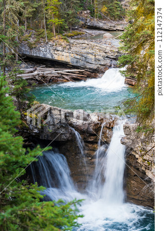 Waterfall in Johnston Canyon, Banff National Park, Canadian Rockies, Alberta, Canada. 112147374