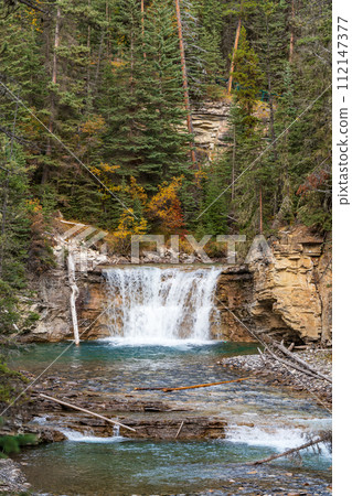 Waterfall in Johnston Canyon, Banff National Park, Canadian Rockies, Alberta, Canada. Waterfall in Johnston Canyon, Banff National Park, Canadian Rockies, Alberta, Canada. 112147377