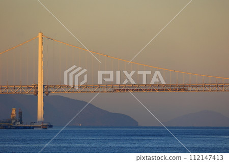 Sunrise Seto crossing the Seto Ohashi Bridge dyed in the morning sun 112147413