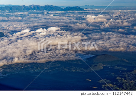 Morning sea of clouds and mountain range of the Southern Alps seen from the summit of Mt. Fuji 112147442