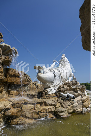 Fragment of the Neptune Fountain in the Schoenbrunn Palace Park 112147759