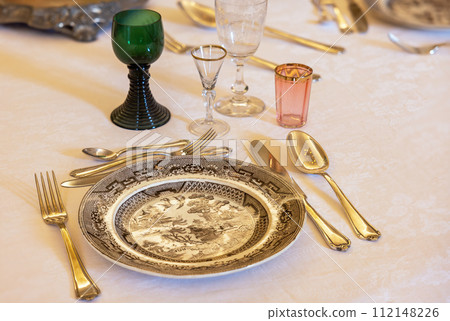 tableware made of glass, porcelain and gold 112148226