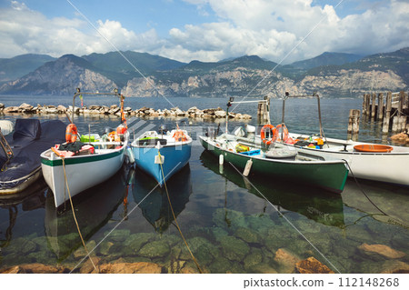 boats and promenade Malcesine on the shores of Lake Garda boats and promenade Malcesine on the shores of Lake Garda 112148268