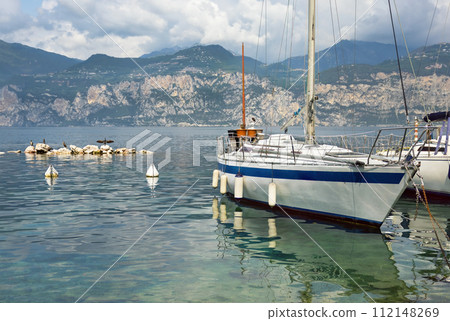boats and promenade Malcesine on the shores of Lake Garda boats and promenade Malcesine on the shores of Lake Garda 112148269