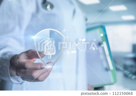 Doctor shows thyroid gland protected by shield. Doctor shows thyroid gland protected by shield. 112150068
