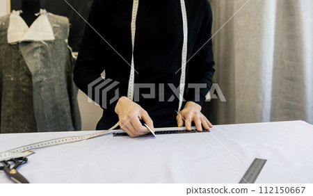 details of the working tailor. details of the working tailor. 112150667