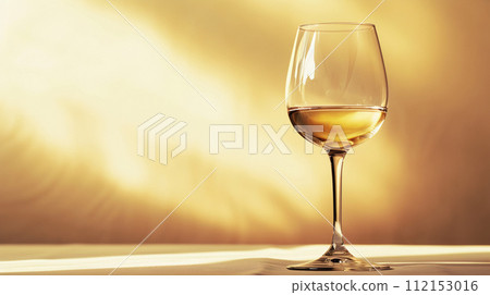 the dynamic elegance of a wine glass, capturing the interplay of light and liquid 112153016
