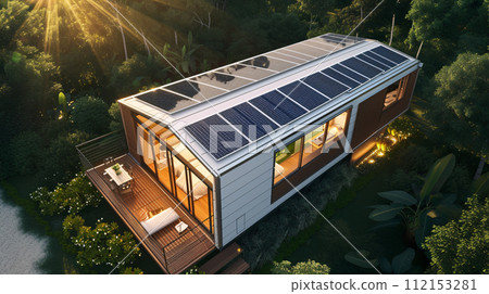 solar panels on a modern tiny house roof top solar panels on a modern tiny house roof top 112153281