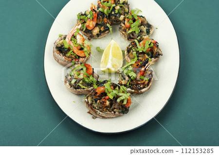 Baked mushroom caps and shrimp Baked mushroom caps and shrimp 112153285