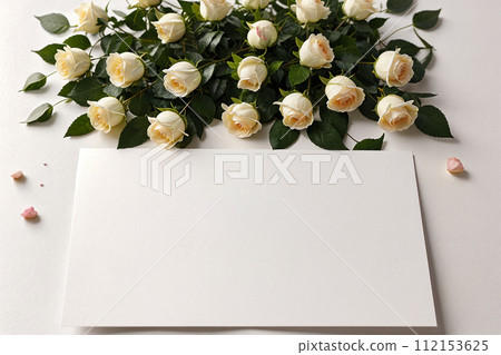 mockup blank postcard letter and bouquet of white roses on light background mockup blank postcard letter and bouquet of white roses on light background 112153625