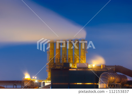 Heavy industry. View of production and factory. Panoramic view of the factory at night. Heavy industry. View of production and factory. Panoramic view of the factory at night. 112153837