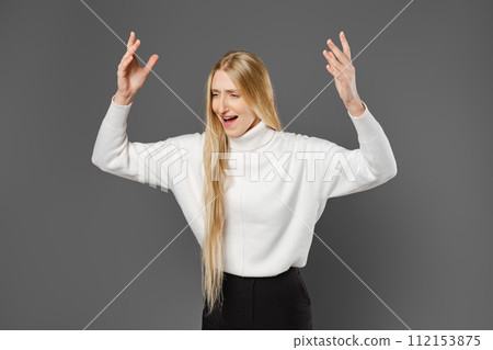 Dissatisfied woman swears and gesticulates emotionally with her hands 112153875