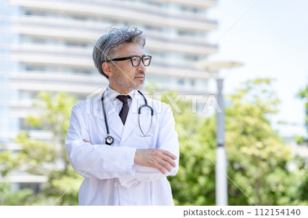 Senior male doctor arms crossed 112154140