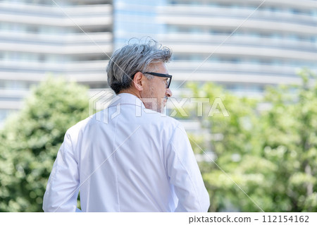 Senior male white coat profile 112154162
