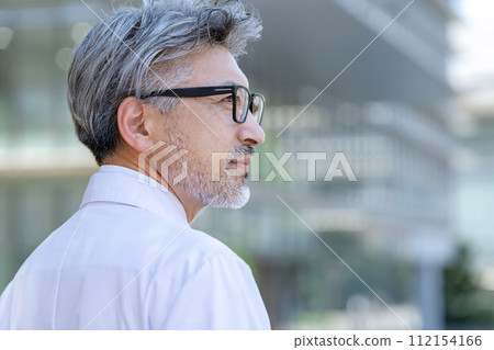 Senior male white coat profile 112154166