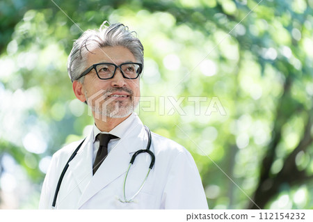 Senior male doctor green Senior male doctor green 112154232