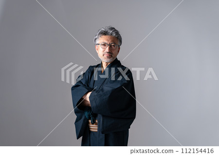 Senior male kimono gray arms folded Senior male kimono gray arms folded 112154416
