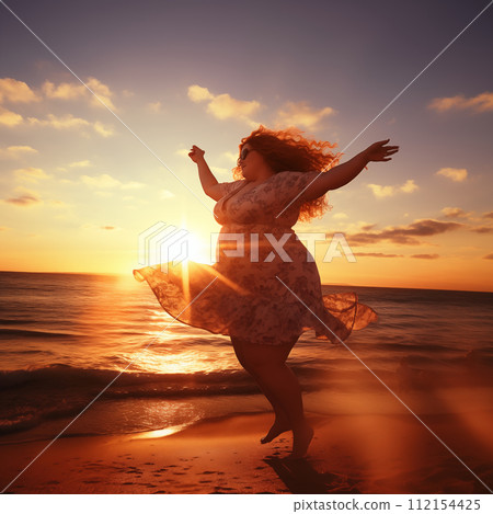 Plump woman dancing on beach 112154425