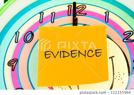 Word Evidence written written on an orange sticker 112155964