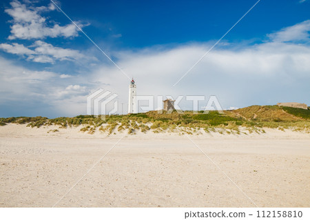 Lighthouse and bunker in the sand dunes on the beach of Blavand, Jutland Denmark Europe Lighthouse and bunker in the sand dunes on the beach of Blavand, Jutland Denmark Europe 112158810