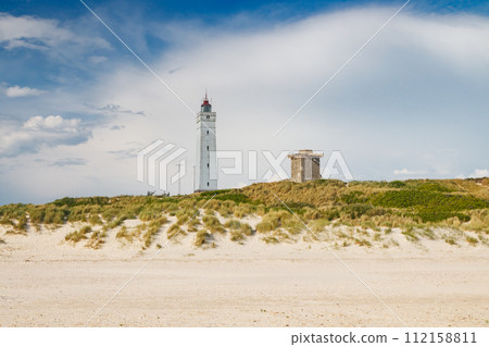 Lighthouse and bunker in the sand dunes on the beach of Blavand, Jutland Denmark Europe Lighthouse and bunker in the sand dunes on the beach of Blavand, Jutland Denmark Europe 112158811