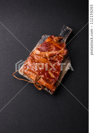 Delicious smoked or grilled ribs with olives, spices and herbs Delicious smoked or grilled ribs with olives, spices and herbs 112159265