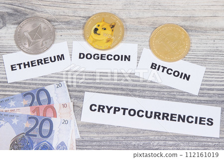 Coins, euro bills and inscription cryptocurrencies. International network payment. Finance concept Coins, euro bills and inscription cryptocurrencies. International network payment. Finance concept 112161019