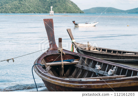 authentic fishing village. fishing boats stand on the seashore 112161203