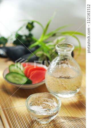 Japanese sake, pickled cucumber and red turnip Japanese sake, pickled cucumber and red turnip 112161512