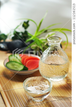 Japanese sake, pickled cucumber and red turnip Japanese sake, pickled cucumber and red turnip 112161513