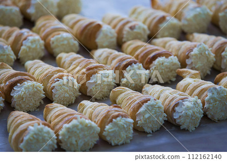 Cake with cream. Tubules with cream. 112162140