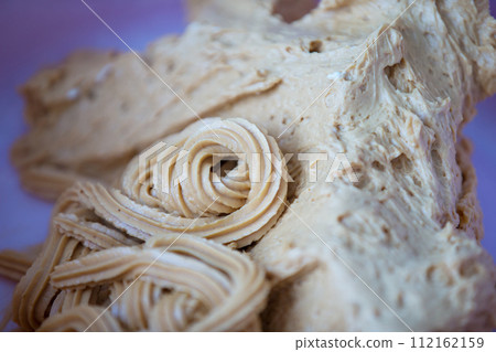 Beautiful texture of a culinary cream close up.Cream oil cake Beautiful texture of a culinary cream close up.Cream oil cake 112162159