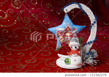 New Year card. Snowman toy with a whisk. New Year's toys. Decoration for the holiday. Souvenirs for the new year. New Year card. Snowman toy with a whisk. New Year's toys. Decoration for the holiday. Souvenirs for the new year. 112162279