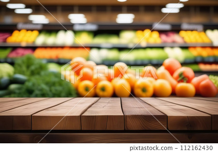 Empty table top with supermarket blurred defocused panorama, bokeh light. Backdrop for display or montage products. Blank wood textured counter with blur grocery, market store background. Front view 112162430