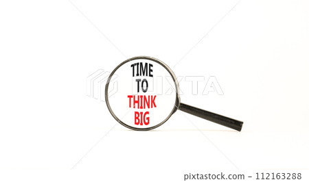 Time to think big symbol. Concept words Time to think big on beautiful magnifying glass. Beautiful white table white background. Business and time to think big concept. Copy space. Time to think big symbol. Concept words Time to think big on beautiful magnifying glass. Beautiful white table white background. Business and time to think big concept. Copy space. 112163288