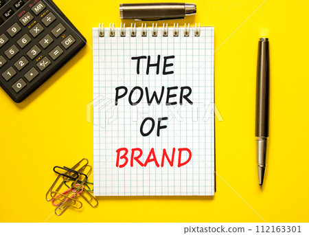 The power of brand symbol. Concept words The power of brand on beautiful white note. Beautiful yellow background. Calculator. Black pen. Business the power of brand concept. Copy space. 112163301
