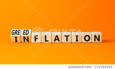 Inflation or greedflation symbol. Concept word Inflation Greedflation on beautiful wooden cubes. Beautiful orange table orange background. Business inflation greedflation concept. Copy space. 112163450