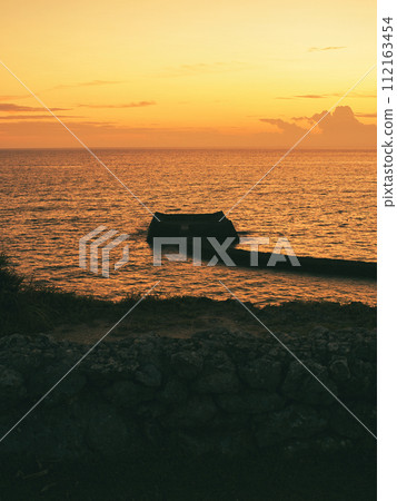 The sky turns red at sunset and Mie Castle, Yomitan Village, Okinawa Prefecture The sky turns red at sunset and Mie Castle, Yomitan Village, Okinawa Prefecture 112163454