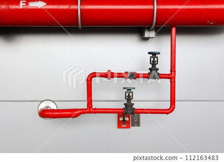 Fire hydrant standpipes or fireplug connection at high rise building for feed water into system when emergency occurred. Concept of fire equipment, safety, fire prevention. Fire hydrant standpipes or fireplug connection at high rise building for feed water into system when emergency occurred. Concept of fire equipment, safety, fire prevention. 112163483